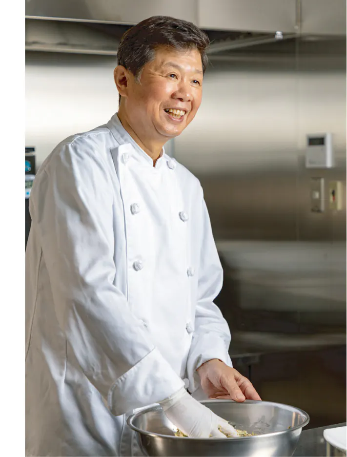 The owner's father in the kitchen