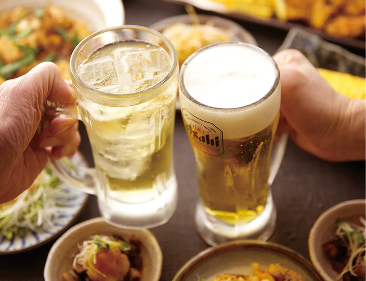 Toasting with beer and a highball